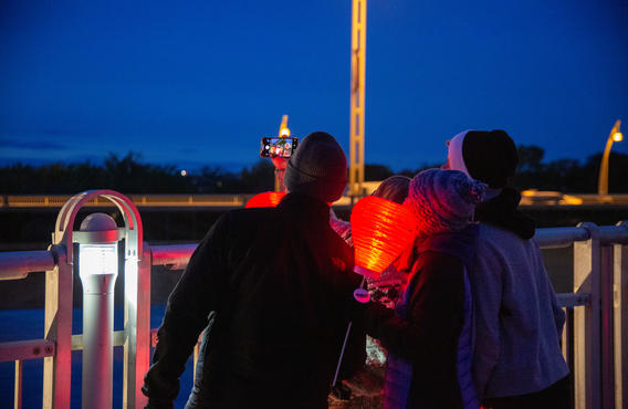 A group of people with Light The Night Lanterns taking a photo